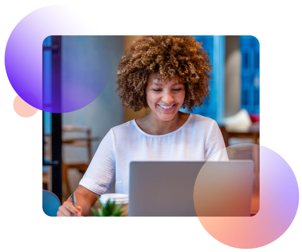 Smiling woman looking at a laptop