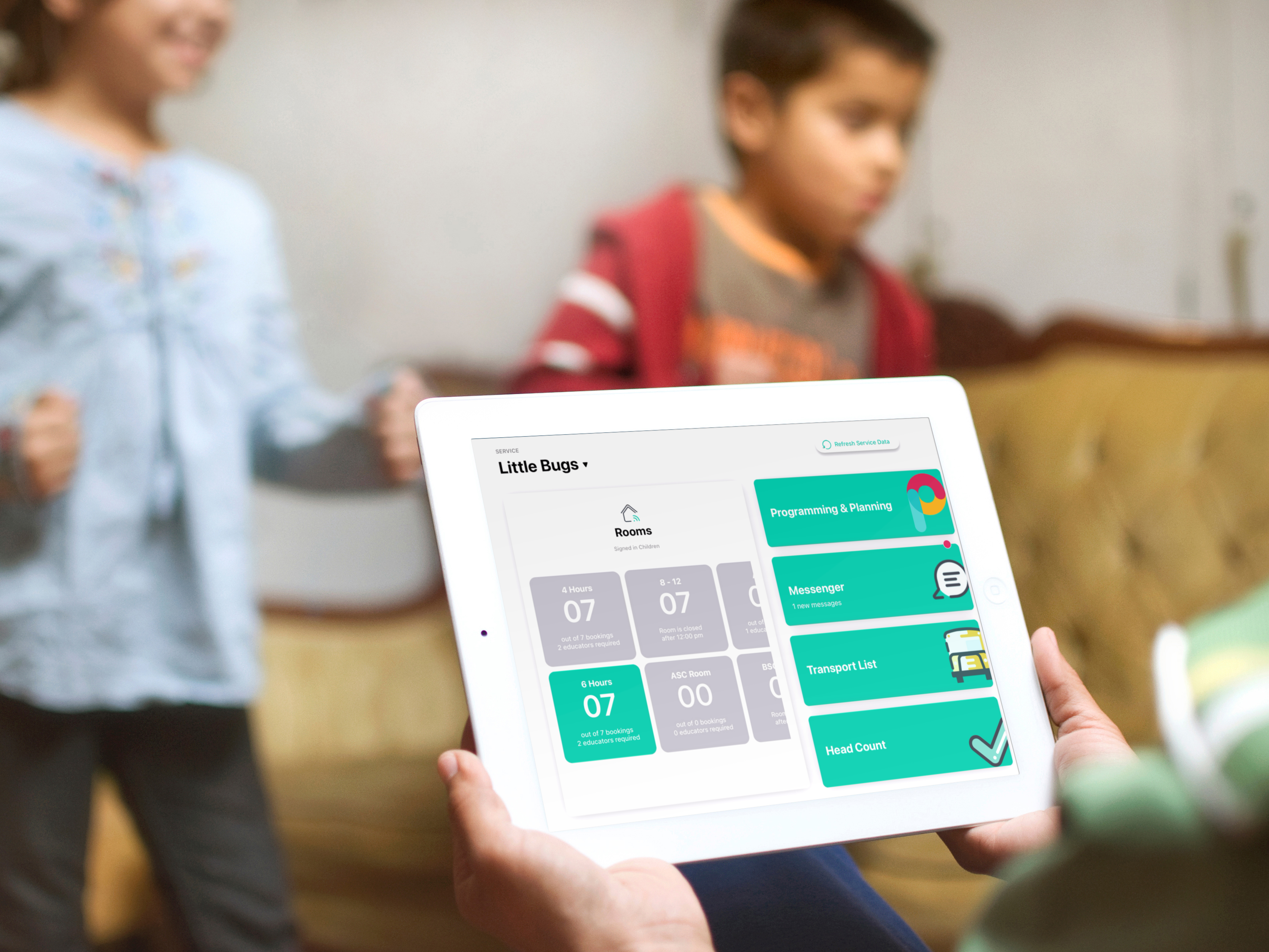 An educator holds a tablet displaying the Playground dashboard showing the new Messenger feature