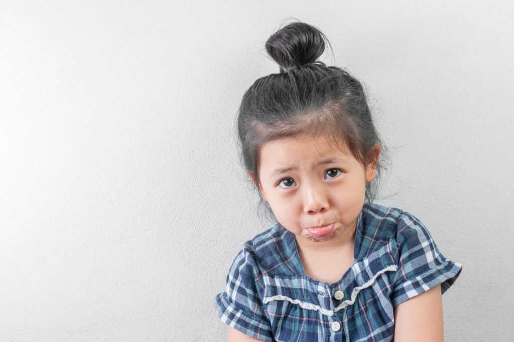 Sad little girl pouting