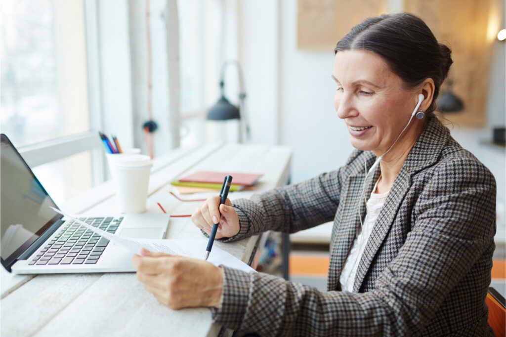 A woman reviewing some reports, EOFY reporting