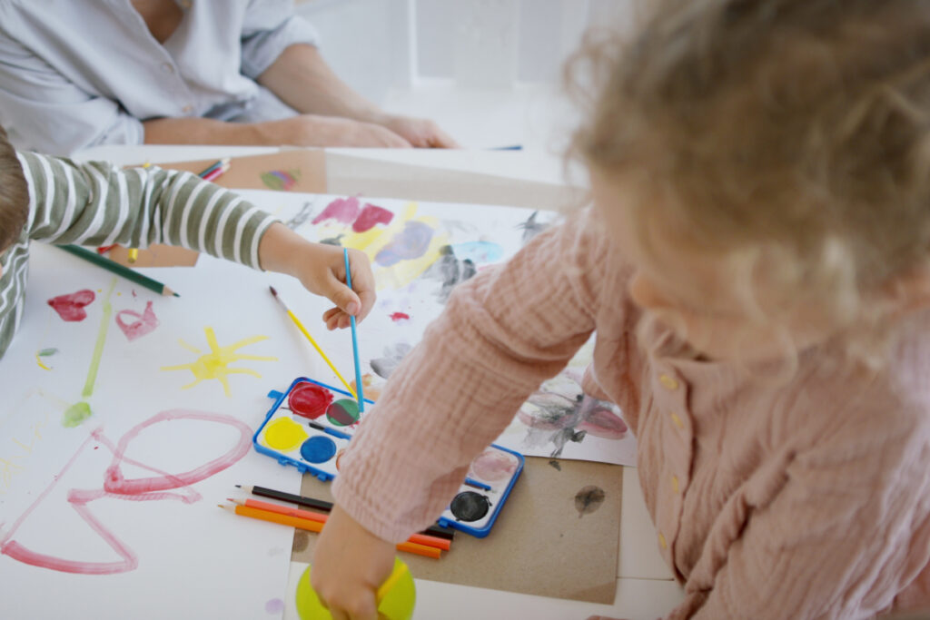 Overhead shot of young children painting